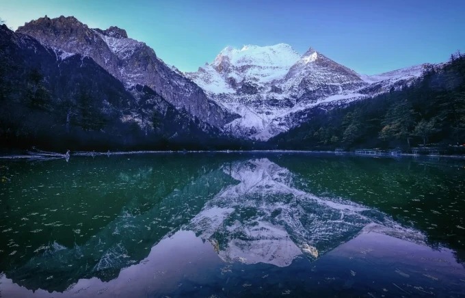 Snow peaks and pasture in the Yading valley