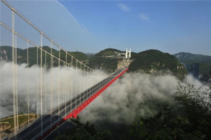 Aizhai Bridge crossing a green mountain gorge