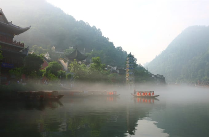 Old town lanes and rooftops beside the Tuo River