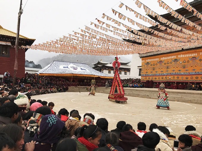 Masked cham dancers during the Monlam festival
