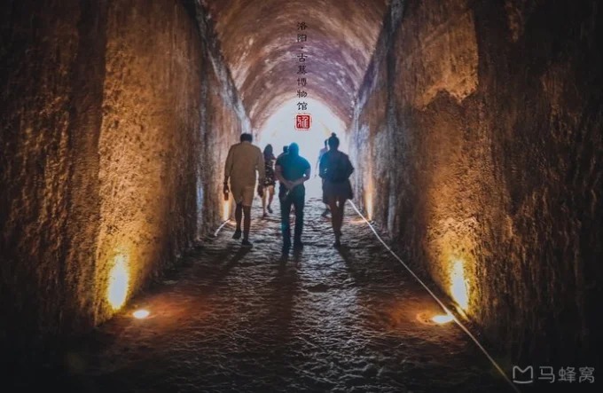 A visitor in a reconstructed tomb passage at Luoyang Ancient Tombs Museum