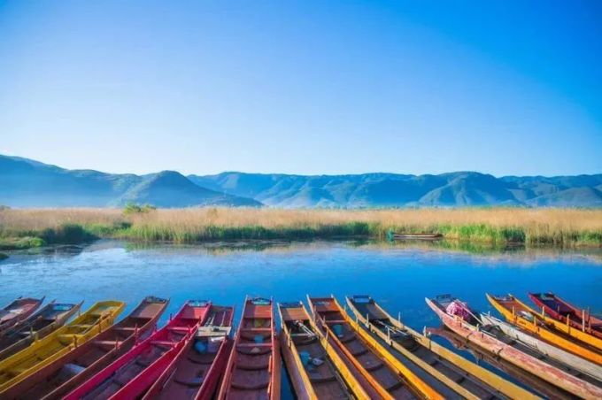 Clear water and mountain slopes at Lugu Lake