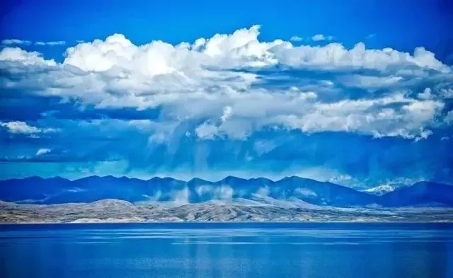 Lake Manasarovar beneath distant mountains