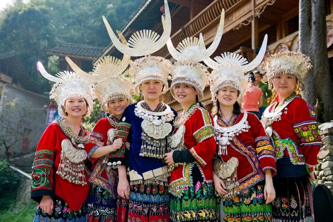 Personas con traje tradicional en Qiandongnan