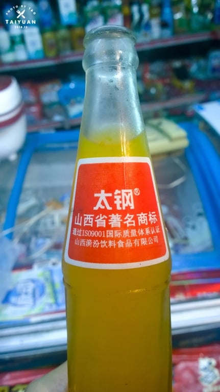 Bouteilles de soda Taigang aux parfums d’orange, de citron et de litchi
