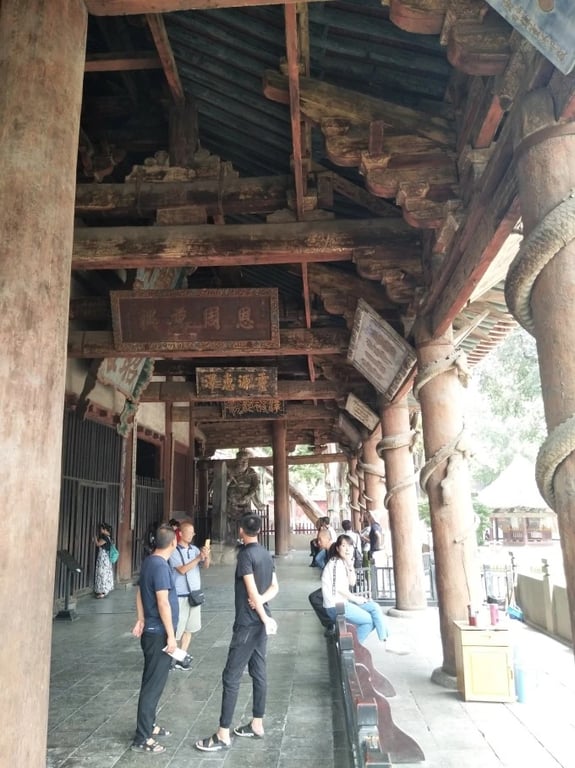 Carved plaques hanging in the corridor of the Goddess Hall