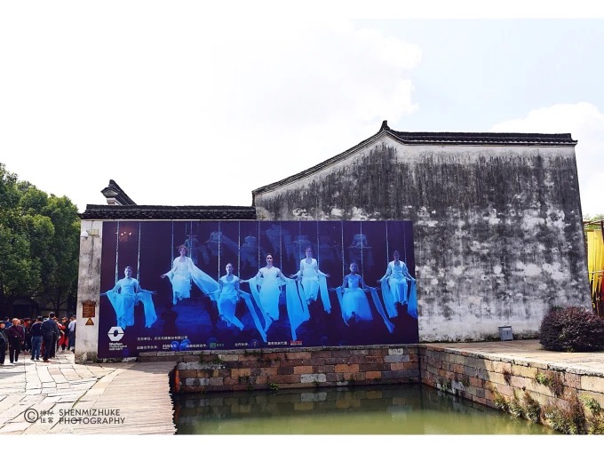 White-walled buildings beside a canal in Wuzhen