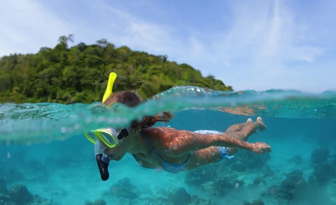 Snorkeller in clear water off Wuzhizhou Island